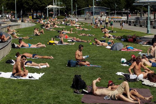 people take a sunbath during a heat wave called quot heat dome quot in the manhattan borough of new york photo reuters