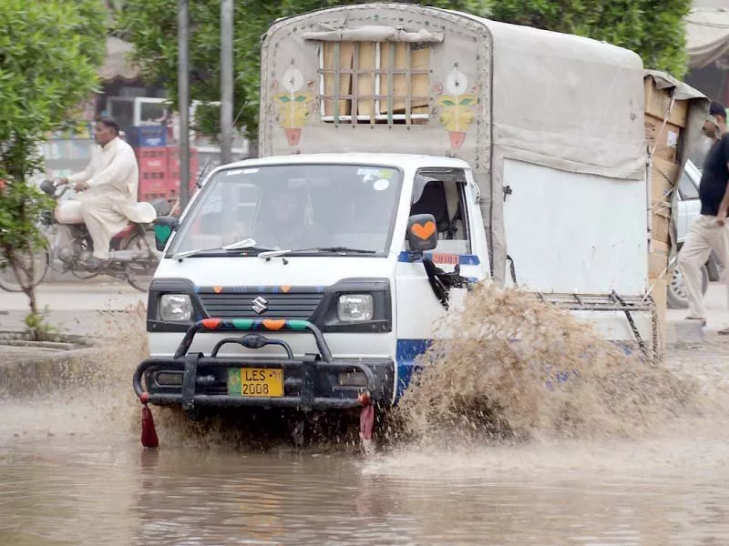a vehicle goes through rainwater photo online a vehicle goes through rainwater photo online