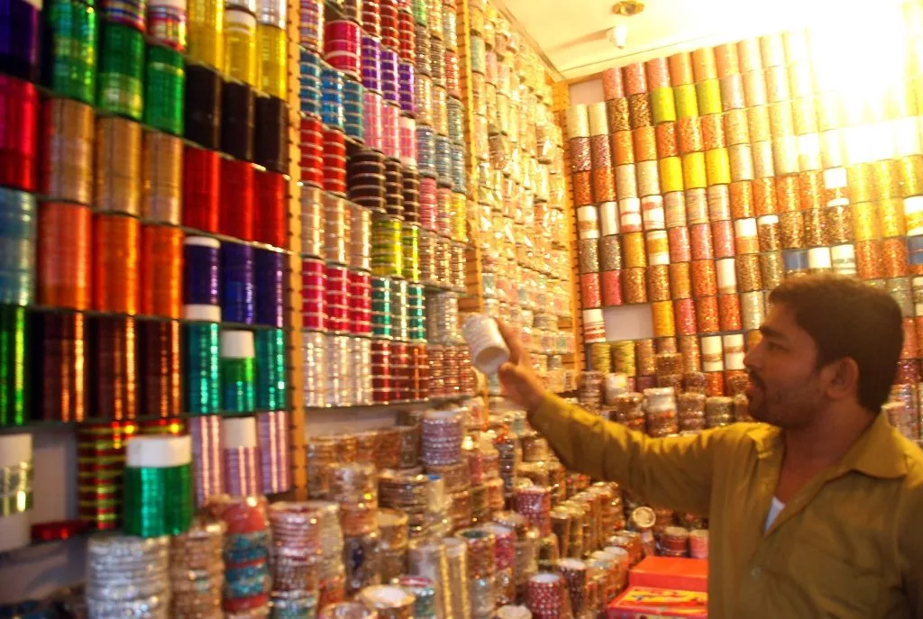 shopkeeper sets up shop awaiting customers sales are higher for shops with bright lights say shopkeepers photo israr ul haq shopkeeper sets up shop awaiting customers sales are higher for shops with bright lights say shopkeepers photo israr ul haq