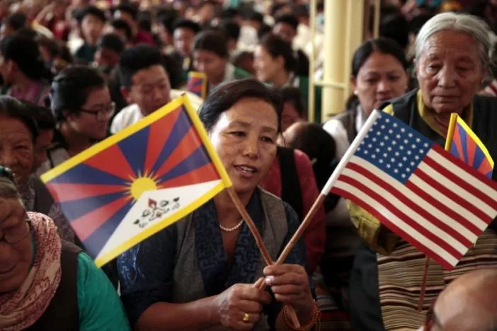 a tibetan refugee holds flags at a function for visiting u s delegates in dharamsala the seat of the dalai lama in india photo reuters a tibetan refugee holds flags at a function for visiting u s delegates in dharamsala the seat of the dalai lama in india photo reuters