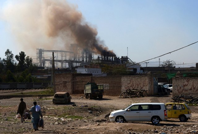 this photograph shows pakistani residents walking near a factory on the outskirts of the northwestern city of peshawar pakistan 039 s cities are gasping for clean air amid dire warnings from the world bank but officials say they are helpless to combat the looming calamity due to a lack of basic data the fast growing country is home to some 200 million people and suffers from some of the worst air pollution in the world thanks to its giant population plying poorly maintained vehicles on the roads and unchecked industrial emissions photo afp