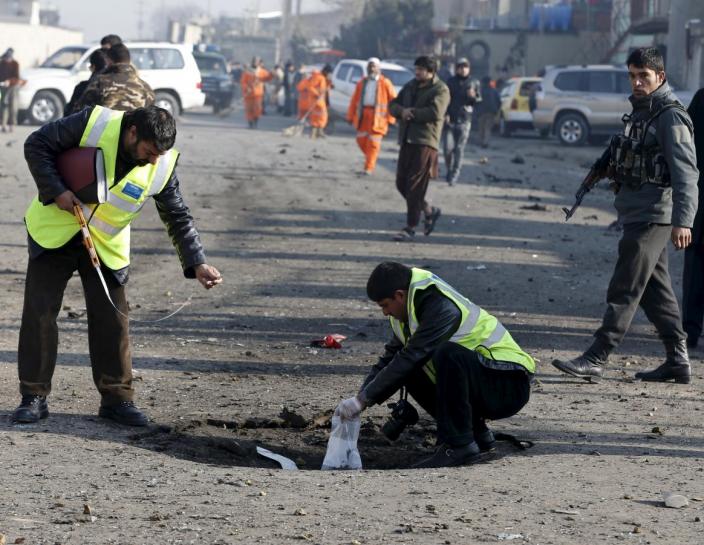 afghan security forces investigate at the site of a suicide bomb attack in kabul afghanistan december 28 2015 photo reuters