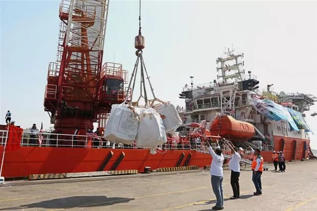 volunteers unloading aid boxes photo afp volunteers unloading aid boxes photo afp