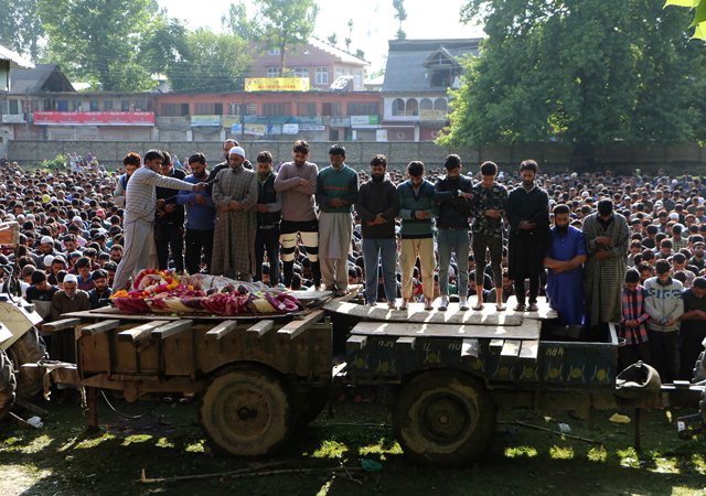 kashmiri villagers offer prayers for a kashmiri rebel over his body during a funeral procession in pulwama south of srinagar on june 22 2017 photo afp