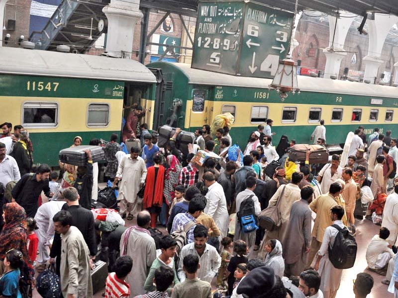 people are seen boarding a train to their native towns to celebrate eid photo abid nawaz express