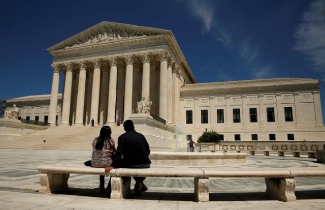 file photo a couple sit in front of the u s supreme court in washington u s on may 16 2016 reuters kevin lamarque file photo