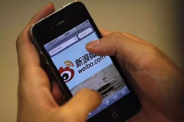 a man holds an iphone as he visits sina 039 s weibo microblogging site in shanghai may 29 2012 photo reuters a man holds an iphone as he visits sina 039 s weibo microblogging site in shanghai may 29 2012 photo reuters