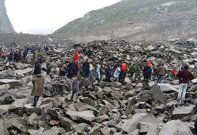 chinese military police and rescue workers are seen at the site of a landslide in in xinmo village diexi town of maoxian county sichuan province on june 24 2017 around 100 people are feared buried after a landslide smashed through their village in southwest china 039 s sichuan province early saturday local officials said as they launched an emergency rescue operation photo afp chinese military police and rescue workers are seen at the site of a landslide in in xinmo village diexi town of maoxian county sichuan province on june 24 2017 around 100 people are feared buried after a landslide smashed through their village in southwest china 039 s sichuan province early saturday local officials said as they launched an emergency rescue operation photo afp