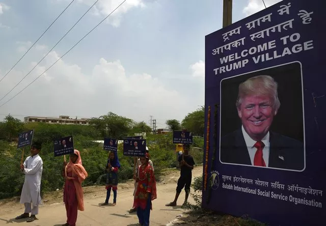 indian children hold placards by the entrance gate of marora village which has been unofficially renamed 039 trump village quot about 100km from new delhi on june 23 2017 photo afp indian children hold placards by the entrance gate of marora village which has been unofficially renamed 039 trump village quot about 100km from new delhi on june 23 2017 photo afp