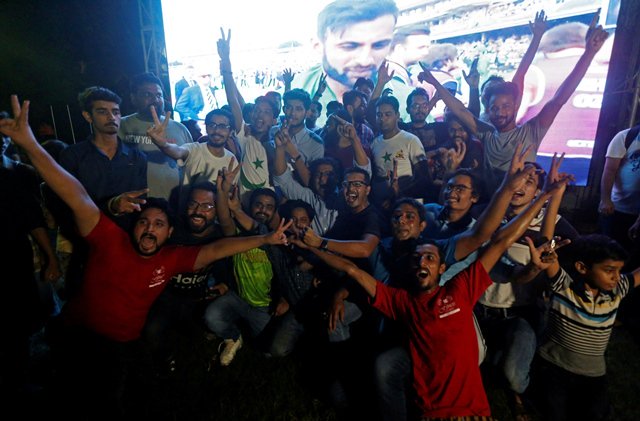 jubilant cricket fans in karachi celebrate in front of a screen after pakistan defeated india in the icc champions trophy finals photo reuters