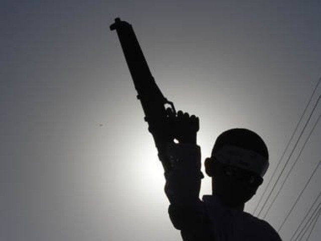 a boy is silhouetted against the sun as he holds a toy gun photo reuters a boy is silhouetted against the sun as he holds a toy gun photo reuters