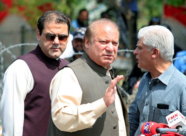 prime minister nawaz sharif standing beside his son hussain nawaz photo reuters