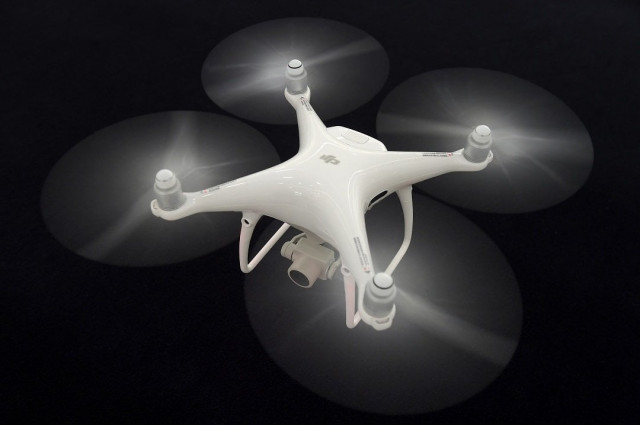 china drone maker dji is betting on flying machines that shoot pesticide instead of photos to fend off growing competition in the global remote controlled aircraft market photo afp china drone maker dji is betting on flying machines that shoot pesticide instead of photos to fend off growing competition in the global remote controlled aircraft market photo afp