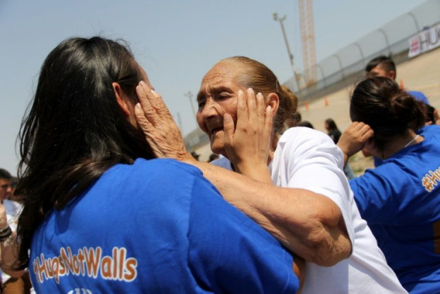 families separated by the us mexico border are reunited for a few minutes in a quot hugs not walls quot event in ciudad juarez mexico on june 24 2017 photo afp
