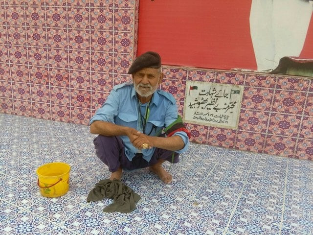 abdul gahfoor cleans the site where former prime minister benazir bhutto was assassinated
