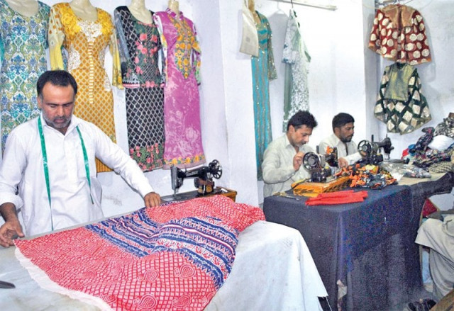 tailors busy at their workplace ahead of eidul fitr photo online