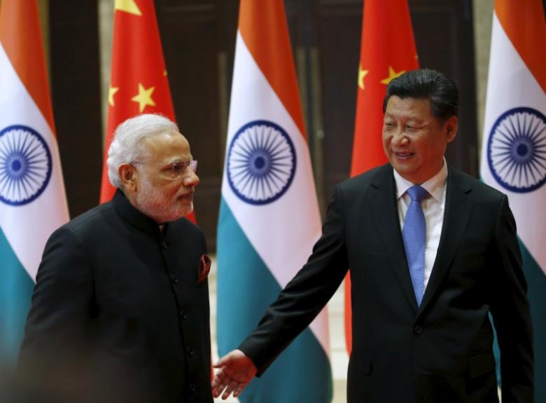 chinese president xi jinping r guides indian prime minister narendra modi to a meeting room in xian shaanxi province china may 14 2015 photo reuters
