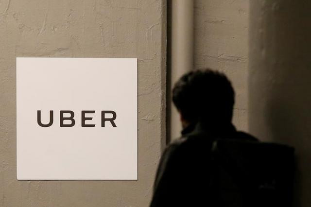 a man arrives at the uber offices in queens new york us february 2 2017 photo reuters a man arrives at the uber offices in queens new york us february 2 2017 photo reuters