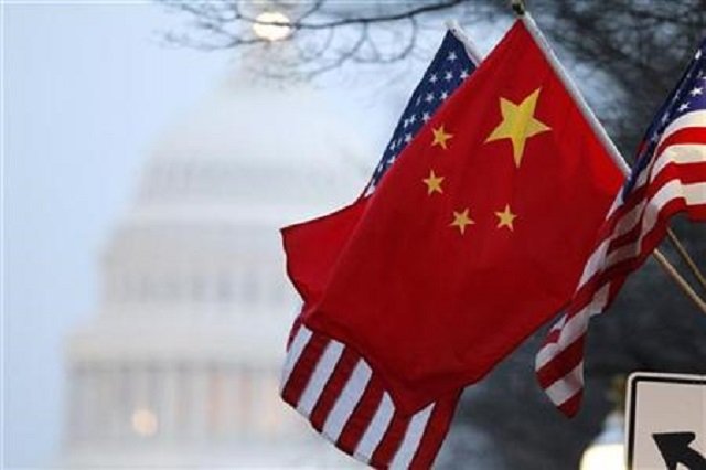 the people 039 s republic of china flag and the u s stars and stripes fly along pennsylvania avenue near the u s capitol in washington during chinese president hu jintao 039 s state visit photo reuters