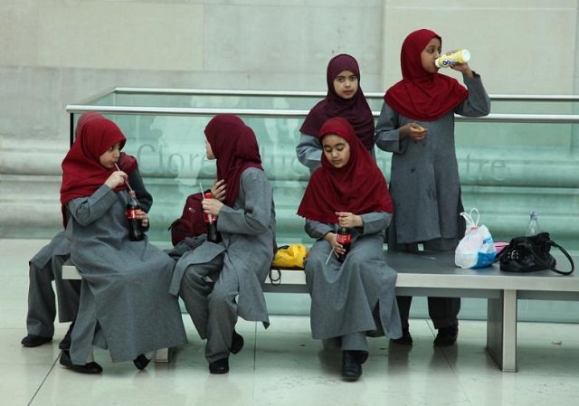 a group of young school girls take a snack break at the british museum london photo reuters