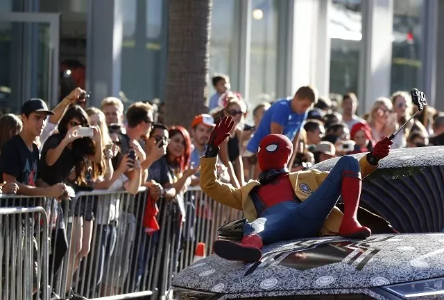 mesmerised fans watch on as the stars of the film arrive for the premiere held in los angeles photo reuters mesmerised fans watch on as the stars of the film arrive for the premiere held in los angeles photo reuters