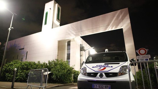 a police vehicle is stationed outside a mosque june 29 2017 in the paris suburb of creteil after a man tried to drive a car into a crowd front of the islamic religious facility photo afp