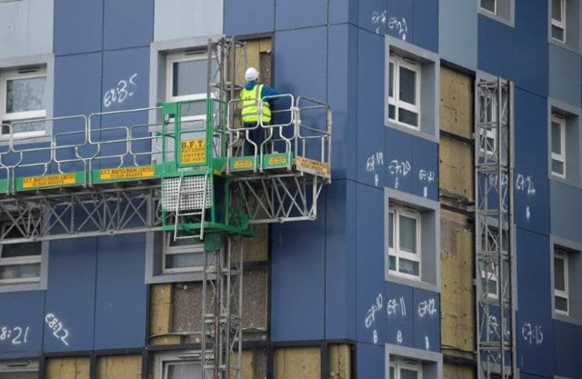 a worker removes cladding from a residential tower block in cranford in west london britain june 28 2017 photo reuters a worker removes cladding from a residential tower block in cranford in west london britain june 28 2017 photo reuters