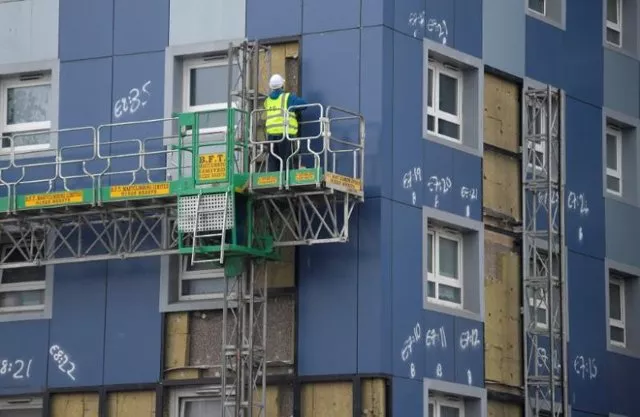 a worker removes cladding from a residential tower block in cranford in west london britain june 28 2017 photo reuters a worker removes cladding from a residential tower block in cranford in west london britain june 28 2017 photo reuters