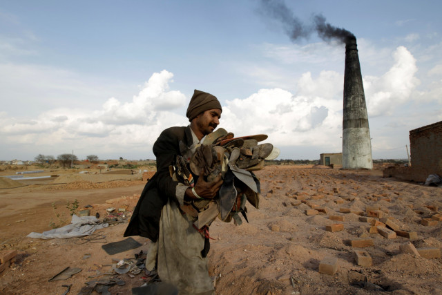 a worker carries shoes to be burned in the kiln of a brick factory in islamabad pakistan march 9 2017 photo reuters a worker carries shoes to be burned in the kiln of a brick factory in islamabad pakistan march 9 2017 photo reuters