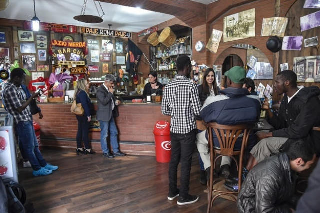migrants and residents stand in the main bar of sant 039 alessio in aspromonte a small village of 330 inhabitants in calabria southern italy on april 6 2017 photo afp migrants and residents stand in the main bar of sant 039 alessio in aspromonte a small village of 330 inhabitants in calabria southern italy on april 6 2017 photo afp