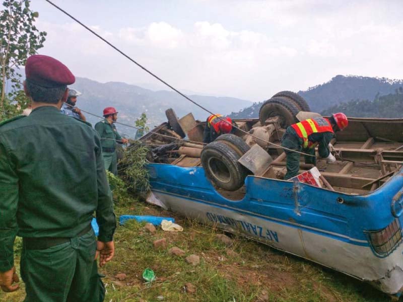 rescue officials attach a line to the bus photo express