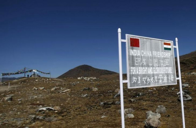 a signboard is seen from the indian side of the indo china border at bumla in arunachal pradesh photo reuters a signboard is seen from the indian side of the indo china border at bumla in arunachal pradesh photo reuters