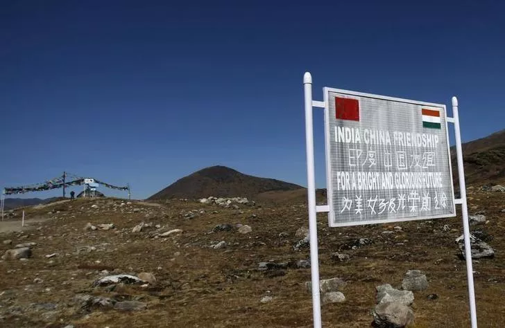 a signboard is seen from the indian side of the indo china border at bumla in arunachal pradesh photo reuters a signboard is seen from the indian side of the indo china border at bumla in arunachal pradesh photo reuters