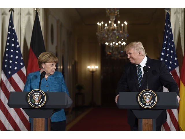 us president donald trump and german chancellor angela merkel hold a joint press conference in the east room of the white house in washington dc on march 17 2017 photo afp