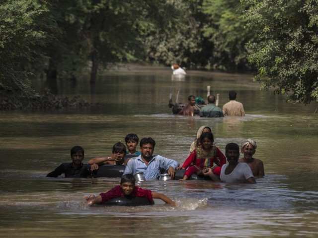 in this file photo flood victims wade through a flooded area along a road as they wait for help in multan september 13 2014 photo reuters in this file photo flood victims wade through a flooded area along a road as they wait for help in multan september 13 2014 photo reuters