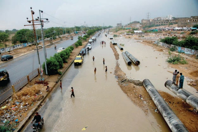 flooded road the university road was covered with water after rains due to inefficient drainage photo file flooded road the university road was covered with water after rains due to inefficient drainage photo file