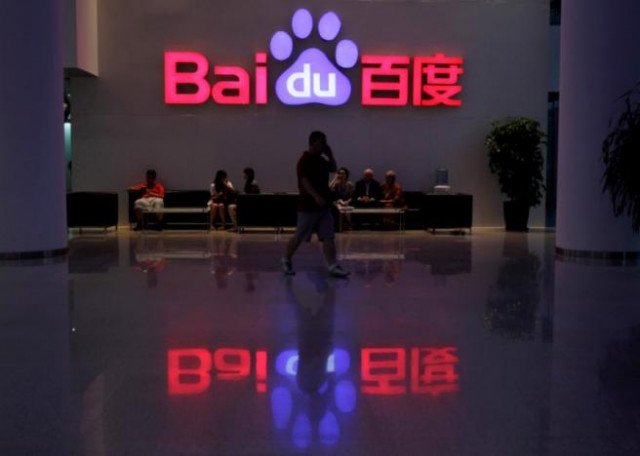 file photo a employee uses his mobile phone as he walks past the company logo of baidu at its headquarters in beijing august 5 2010 photo reuters file photo a employee uses his mobile phone as he walks past the company logo of baidu at its headquarters in beijing august 5 2010 photo reuters