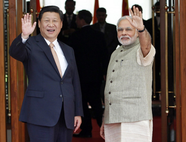 india 039 s prime minister narendra modi r and china 039 s president xi jinping wave before their meeting in ahmedabad september 17 2014 photo reuters file india 039 s prime minister narendra modi r and china 039 s president xi jinping wave before their meeting in ahmedabad september 17 2014 photo reuters file
