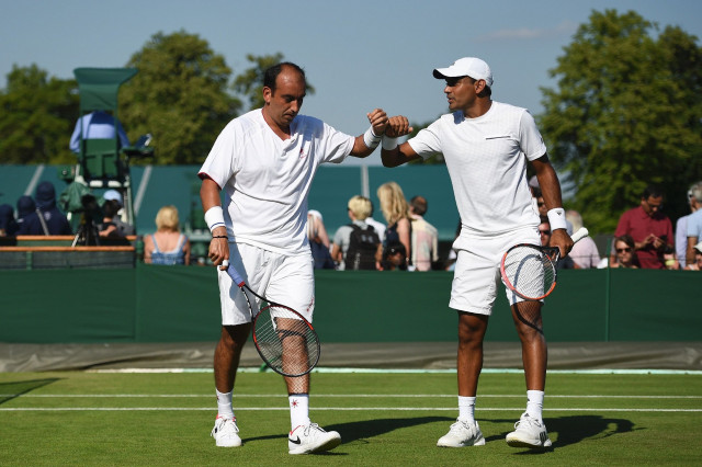 off the mark raja and sharan ended their long wait for a first victory at the all england club as they defeated kyle edmund and joao sousa 7 6 7 2 3 6 6 4 7 6 8 6 in a tense first round clash lasting more than three hours photo afp off the mark raja and sharan ended their long wait for a first victory at the all england club as they defeated kyle edmund and joao sousa 7 6 7 2 3 6 6 4 7 6 8 6 in a tense first round clash lasting more than three hours photo afp
