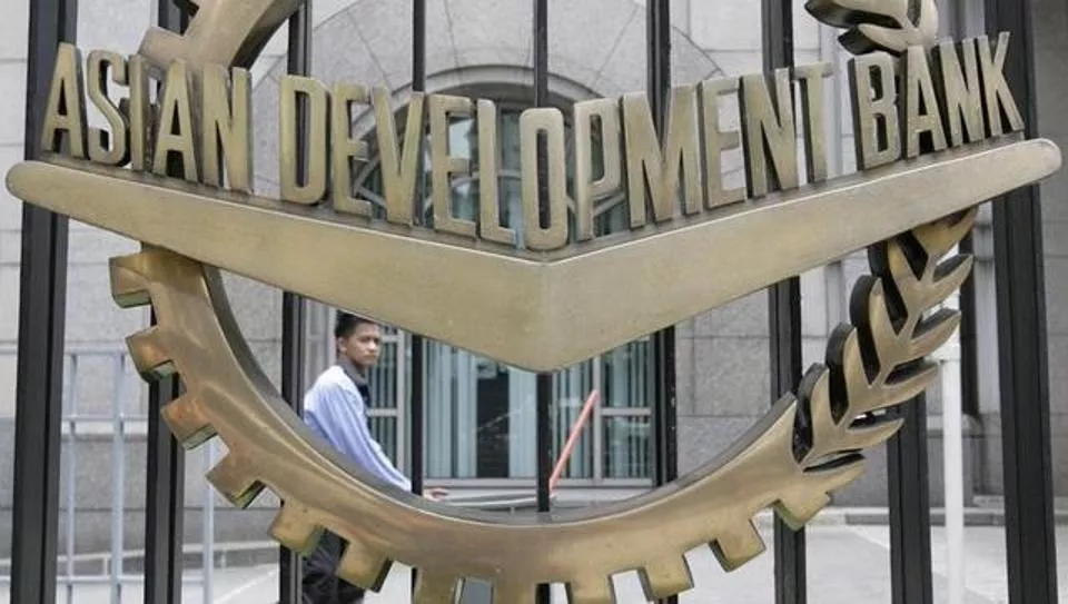 a worker walks past inside the asian development bank adb headquarters in manila photo reuters a worker walks past inside the asian development bank adb headquarters in manila photo reuters