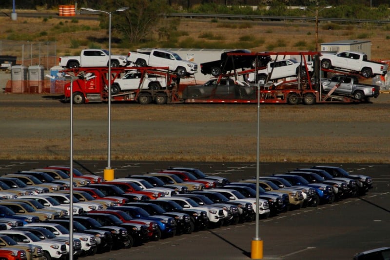 newly assembled vehicles are seen at a stockyard of the automobile plant photo reuters