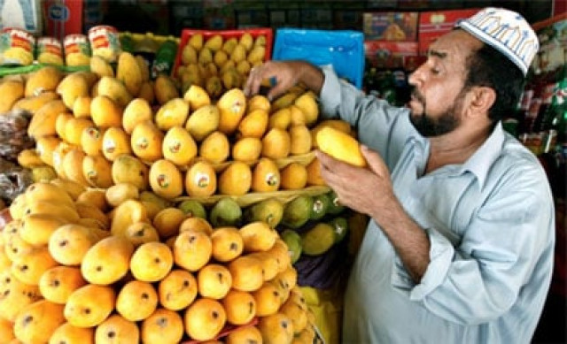 a man selling pakistani mangoes photo reuters a man selling pakistani mangoes photo reuters