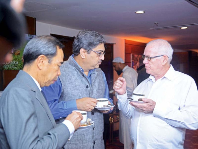 tea lovers enjoy their favorite drink at the party photo express tea lovers enjoy their favorite drink at the party photo express