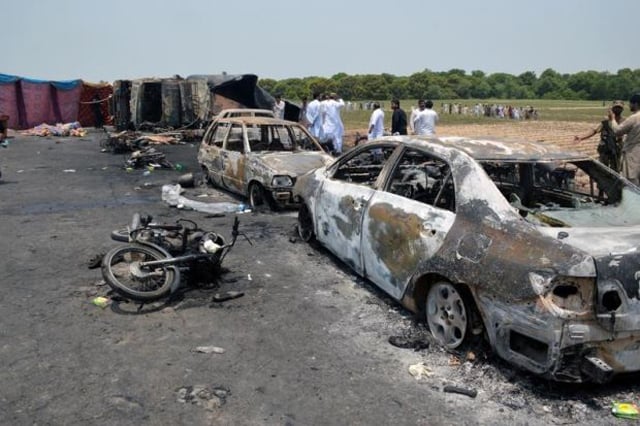 burnt out cars and motorcycles are seen at the scene of an oil tanker explosion in bahawalpur pakistan june 25 2017 photo reuters