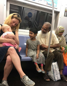 this photo of a muslim family smiling at an american baby goes viral for good reason