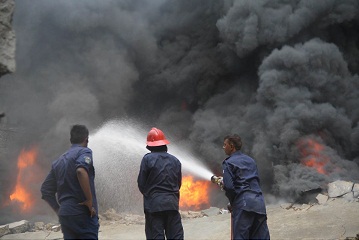 in flames firefighters putting out a blaze which erupted on friday at a plastic factory in new karachi industrial area partially damaging two other adjoining textile production facilities photo online