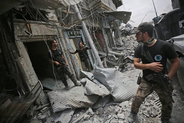 iraqi counter terrorism service cts members stand amid destroyed buildings in the old city of mosul on july 7 2017 during the iraqi government forces 039 offensive to retake the city from islamic state is group fighters the decaying bodies of foreign militants are piling up among the ruins of mosul where the last dozens of islamic state group fighters are mounting a desperate last stand photo afp iraqi counter terrorism service cts members stand amid destroyed buildings in the old city of mosul on july 7 2017 during the iraqi government forces 039 offensive to retake the city from islamic state is group fighters the decaying bodies of foreign militants are piling up among the ruins of mosul where the last dozens of islamic state group fighters are mounting a desperate last stand photo afp
