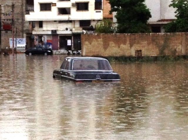 a car submerged in rain water photo express a car submerged in rain water photo express
