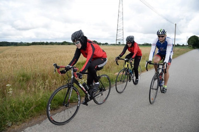 afghanistan 039 s riders masomah c zahra alizada front l and thierry communal r take part in a cycling training session photo afp afghanistan 039 s riders masomah c zahra alizada front l and thierry communal r take part in a cycling training session photo afp