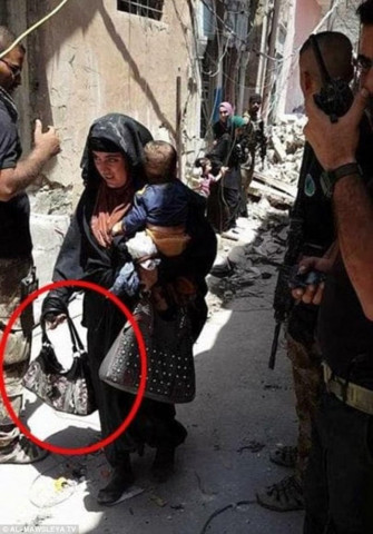 female suicide bomber holding her baby is pictured moments before she blew the two of them up in mosul seconds from detonation female suicide bomber holding her baby is pictured moments before she blew the two of them up in mosul in a bid to slaughter soldiers a photo emerged of a mosul woman with her baby before detonating a bomb photo al mawsleya tv female suicide bomber holding her baby is pictured moments before she blew the two of them up in mosul seconds from detonation female suicide bomber holding her baby is pictured moments before she blew the two of them up in mosul in a bid to slaughter soldiers a photo emerged of a mosul woman with her baby before detonating a bomb photo al mawsleya tv